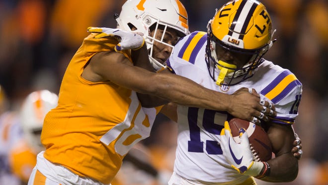 Tennessee defensive back Nigel Warrior (18) tackles LSU wide receiver Derrick Dillon (19) during a game between Tennessee and LSU at Neyland Stadium in Knoxville, Tennessee, on Saturday, Nov. 18, 2017.