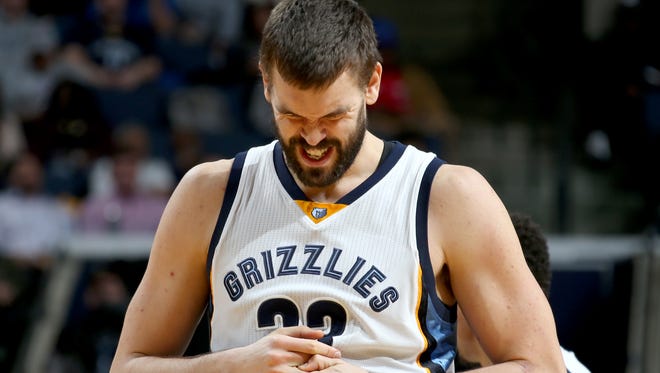 Memphis Grizzlies center Marc Gasol grabs his hand after a play against the Philadelphia 76ers. 