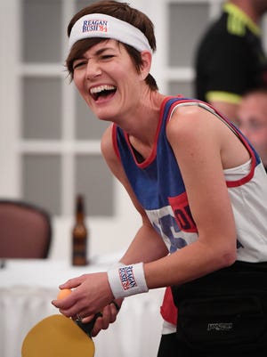 Having difficulty getting her serve off, due to laughter, Mary Allen competes in the first annual Haynie’s Corner Open Sunday. The ping pong tournament was held in the Sauced ballroom as a fundraiser for the Haynie’s Corner Art District Association, August 6, 2017.