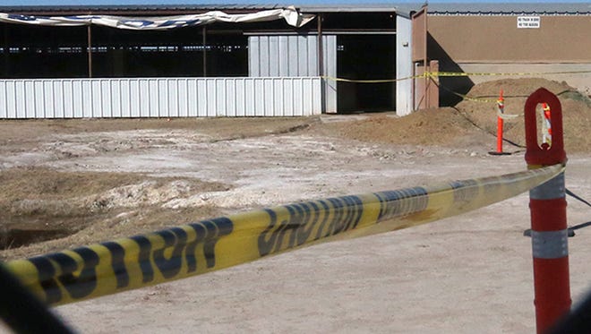 Yellow caution tape surrounds an entrance to a horse stable area along Racetrack Drive at Sunland Park Racetrack and Casino. Racing was halted on Jan. 23.