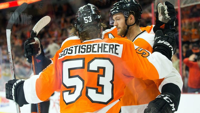 Shayne Gostisbehere and Sean Couturier, right, will suit up for Team North America in next month's World Cup of Hockey.
