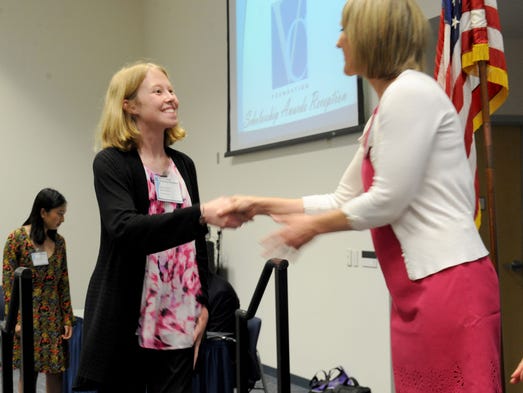 Cianna Calia shakes the hand of Darrin Peschka, news