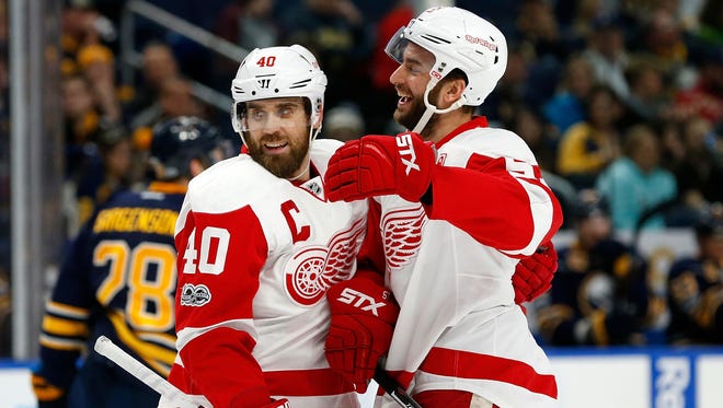 Red Wings center Frans Nielsen (51) celebrates his goal with left wing Henrik Zetterberg (40) during the first period Friday in Buffalo.