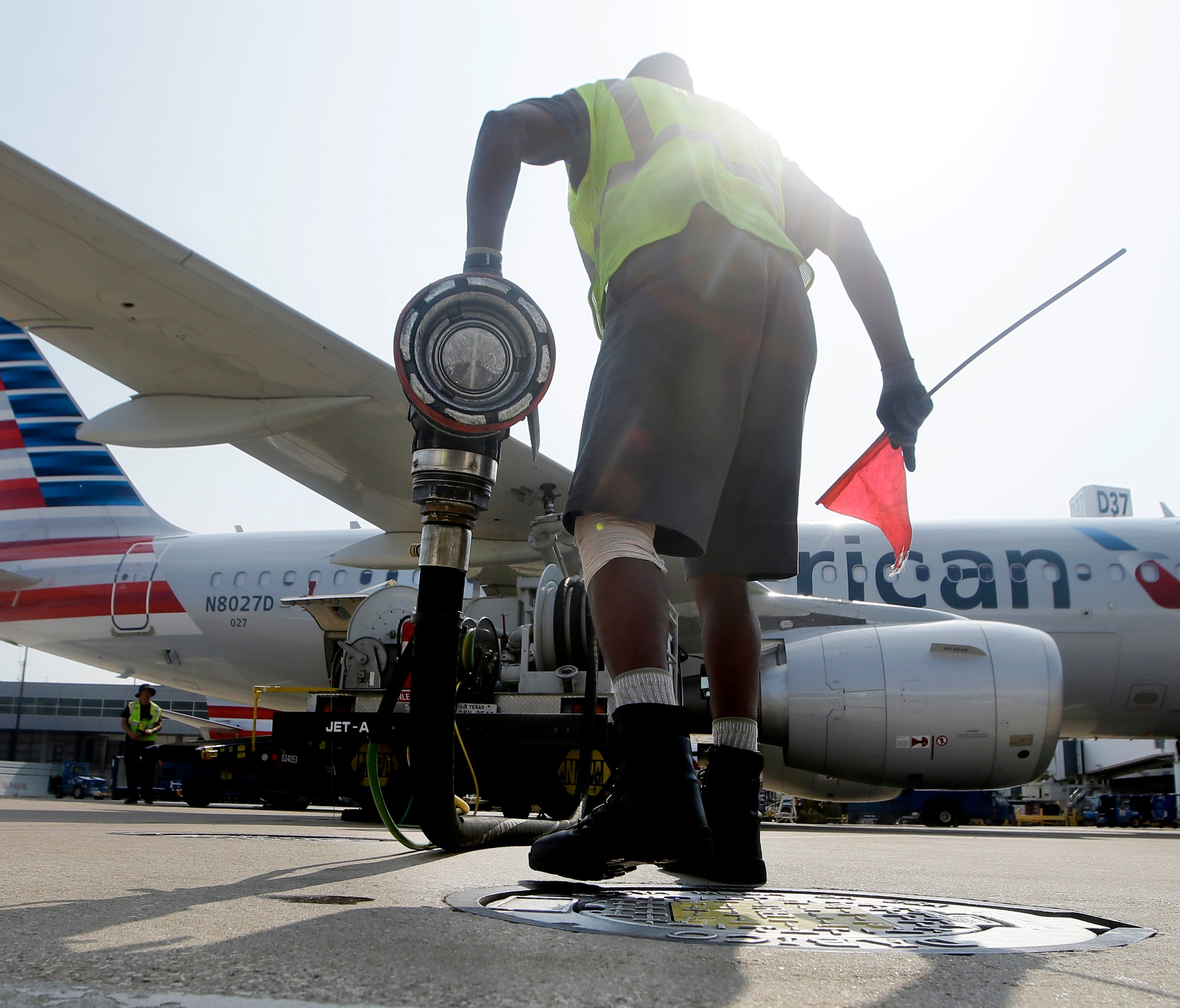 Scott Mills finishes fueling up an American Airlines jet at Dallas/Fort Worth International Airport on Aug. 26, 2015.