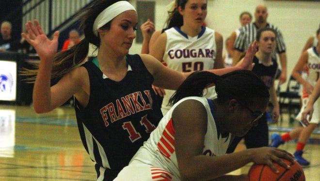 Franklin's Sarah Cramton cuts off Aleea Montgomery's path to the basket Wednesday night.