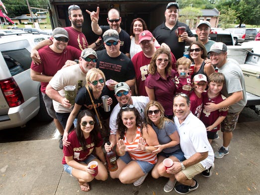 Miami Hurricanes and Florida State Seminoles fans enjoy