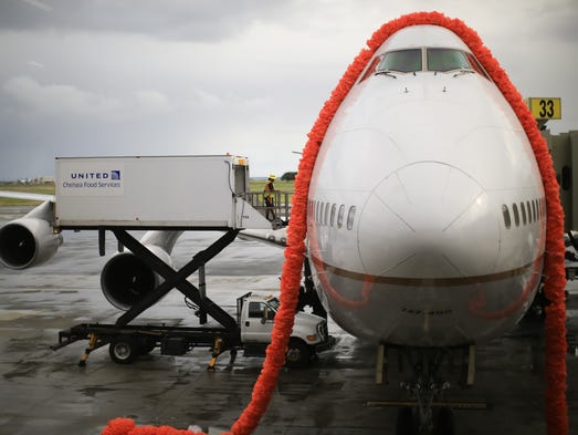 A lei made of old trash bags, custom-made by United