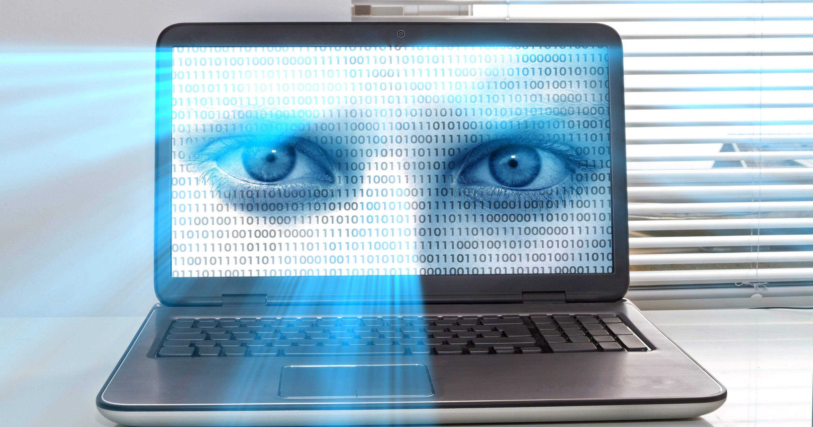 Computers: Click, laptop took surprise photo of me!