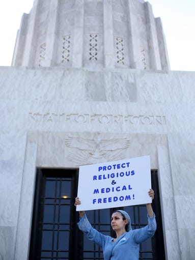 Canada Saunders, of Salem, advocates during a "No on