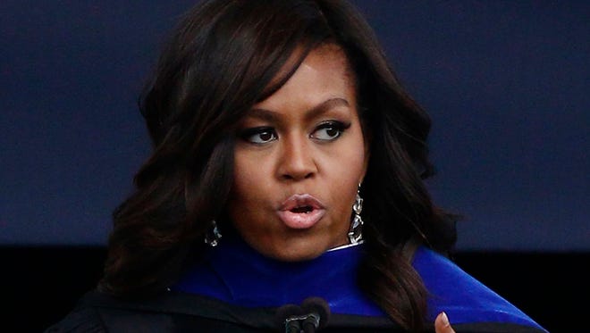 First lady Michelle Obama encourages the graduating seniors to draw upon the strength of the state's civil rights movement when confronting racism or criticism as part of her commencement address at graduation ceremonies for Jackson State University's Class of 2016, at the Mississippi Veterans Memorial Stadium in Jackson, Miss., Saturday.