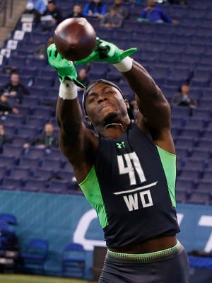 Ole Miss wide receiver Laquon Treadwell jumps up to to catch a pass during the 2016 NFL Scouting Combine at Lucas Oil Stadium.