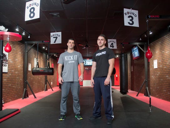 9Round kickboxing gym franchise owner Guy Shaham, left, and trainer Jevareio Gasso in the gym.