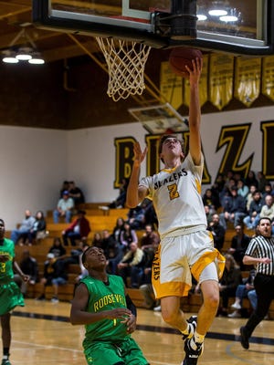 Golden West’s Tucker Stainbrook goes up for two points against Roosevelt on Wednesday.