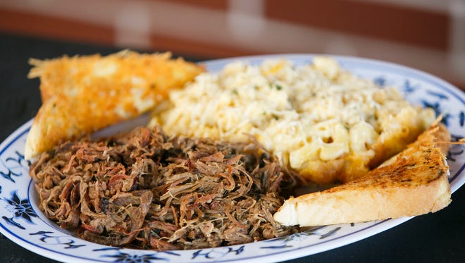 The pulled brisket meal, with Cindy Lou's Mac N Cheese and Texas Garlic Toast, is served at Cindy Lou's BBQ.