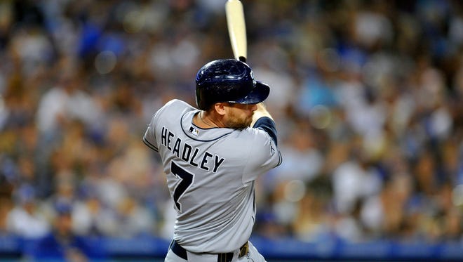 Padres third baseman Chase Headley hits a single against the Los Angeles Dodgers on July 12.