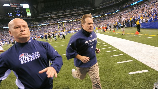 FILE --- New England head coach Bill Belichick sprints off the field after the Colts won 35-34 over the Patriots on Sunday night November 15, 2009. (Matt Detrich / The Star)