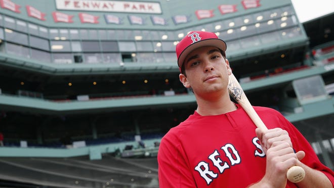 Triston Casas poses at Fenway Park after signing with the Red Sox in 2018.