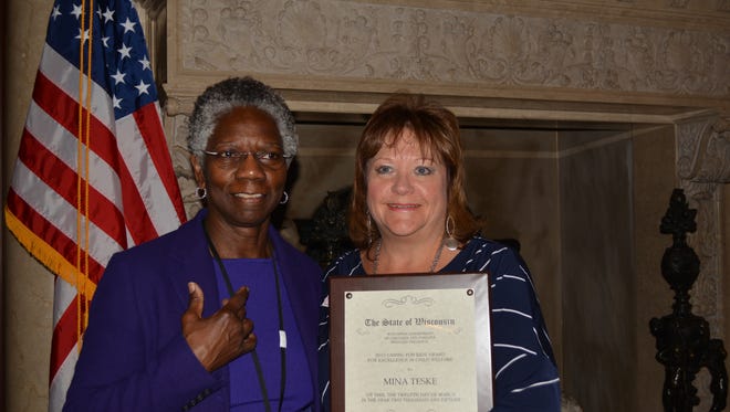 Brown County Social Worker Mina Teske, right, stands next to Wisconsin Department of Children and Families Secretary Eloise Anderson. Teske received a 2015 Caring for Kids award for her dedication to child welfare work.