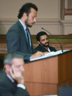 Ron Brandon listens as his attorney, Adam Grosshandler questions Brandon’s brother Michael during Brandon’s trial in Muskingum County Common Pleas Court on Wednesday.