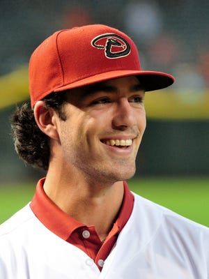 Jul 20, 2015: First overall pick in the 2015 MLB draft Dansby Swanson looks on after signing with the Arizona Diamondbacks  at Chase Field.