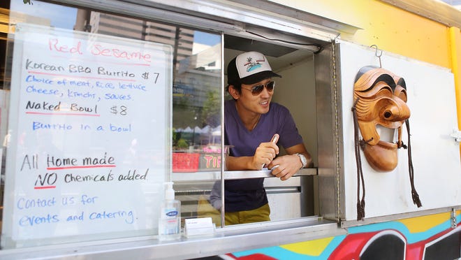
B.J. Kim takes an order at Red Sesame, his Korean BBQ food truck.
