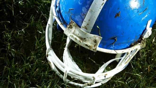 Football helmet on grass