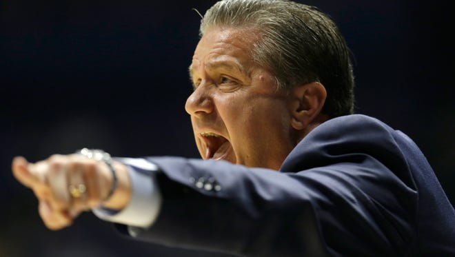 Kentucky head coach John Calipari directs his team against Alabama during the first half of an NCAA college basketball game in the Southeastern Conference tournament in Nashville, Tenn., Friday, March 11, 2016. (AP Photo/Mark Humphrey)