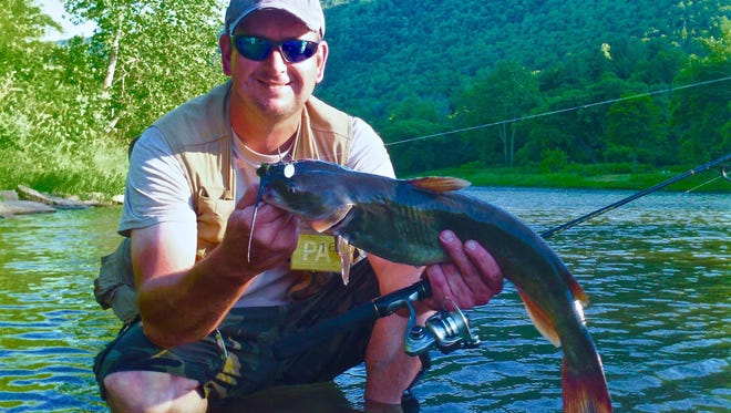 Richard "Mush" Krause landed a 25-inch channel catfish while fishing during a family vacation in the famous Pine Creek Valley.