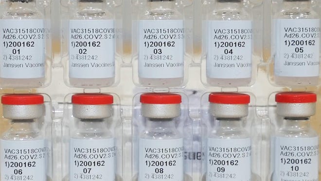 FILE - This Dec. 2, 2020 photo provided by Johnson & Johnson shows vials of the Janssen COVID-19 vaccine in the United States. Johnson & Johnsonâs single-dose vaccine protects against COVID-19, according to an analysis by U.S. regulators Wednesday, Feb. 24, 2021, that sets the stage for a final decision on a new and easier-to-use shot to help tame the pandemic. The Food and Drug Administrationâs scientists confirmed that overall, it's about 66% effective and also said J&J's shot, one that could help speed vaccinations by requiring just one dose instead of two, is safe to use. (Johnson & Johnson via AP)