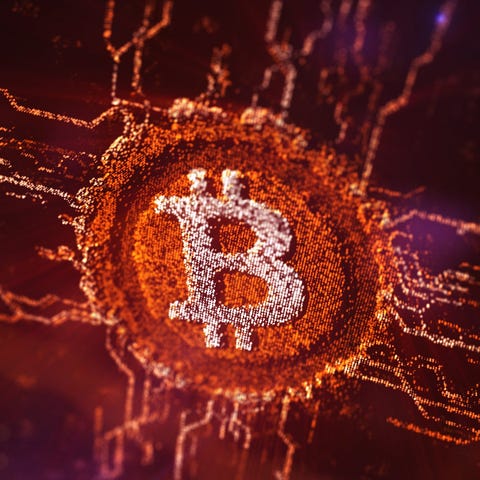 The Bitcoin logo against a digital background