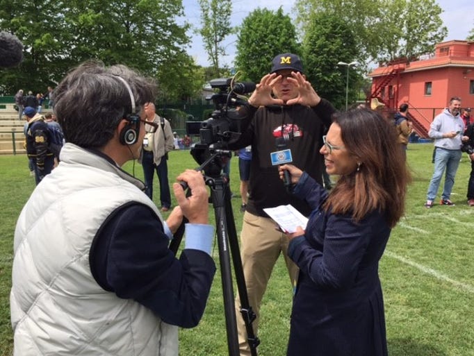 Jim Harbaugh does an interview for representatives