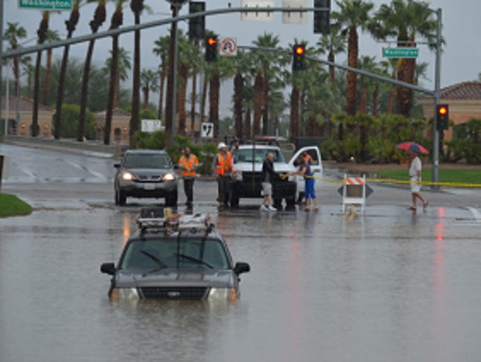 Rain in Palm Desert floods roads, strands vehicles