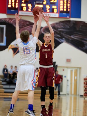 Luxemburg-Casco's Mitchell Jandrin (1) passes around Southern Door's Kyle Daoust  in a boys basketball game at Southern Door High School on Feb.13 in Brussels.