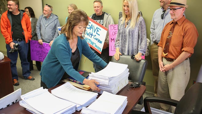 Palm Springs Interim City Clerk Kathleen Hart receives thousands of signatures from the Committee to Save Oswit Canyon at City Hall, January 26, 2017.