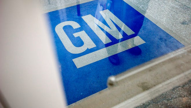 The logo for General Motors decorates the entrance at the site of a GM information technology center in Roswell, Ga.