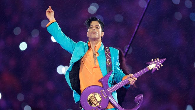 In this Feb. 4, 2007, file photo, Prince performs during the halftime show at the Super Bowl XLI football game at Dolphin Stadium in Miami. Prince, widely acclaimed as one of the most inventive and influential musicians of his era with hits including "Little Red Corvette," ''Let's Go Crazy" and "When Doves Cry," was found dead at his home Thursday in suburban Minneapolis, according to his publicist. He was 57.