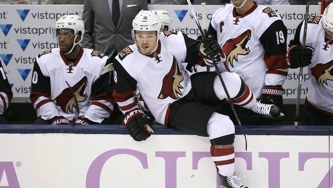 Arizona Coyotes center Max Domi (16) jumps the boards to start a new shift as left wing Anthony Duclair (10) and right wing Shane Doan (19) look on from the bench against the Toronto Maple Leafs at Air Canada Centre. The Coyotes beat the Maple Leafs 4-3.