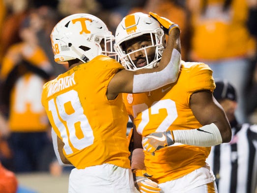 Tennessee defensive back Nigel Warrior (18) hugs Tennessee