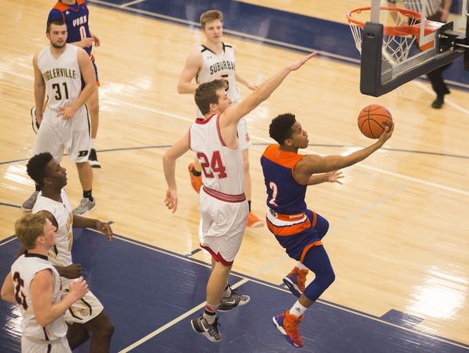 York High's Jacquez Casiano, of Team 2, right, drives