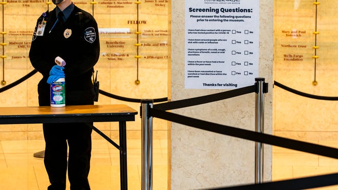 Visitors will have their temperature taken and asked a series of questions related to the COVID-19 pandemic to enter the Abraham Lincoln Presidential Museum in Springfield, Ill.