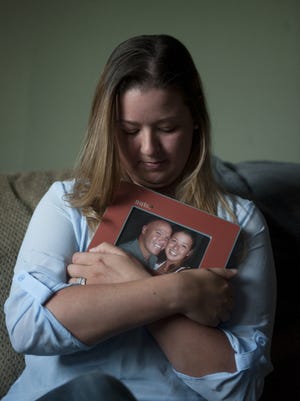 Nicole Fimple of Williamstown holds a photograph of her and fiance, Jody Ousey, who died after contracting pneumonia. Though he'd had leukemia, the couple thought he would be OK and had planned to marry in August. Unfortunately, he passed away Dec. 30, and now she is dealing with the aftermath of his not having a will.  10.15.15