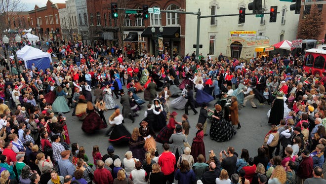 The Flat Creek Community Contra Dancers perform during the Dickens of a Christmas street festival in Franklin.JOHN PARTIPILO/The Tennessean