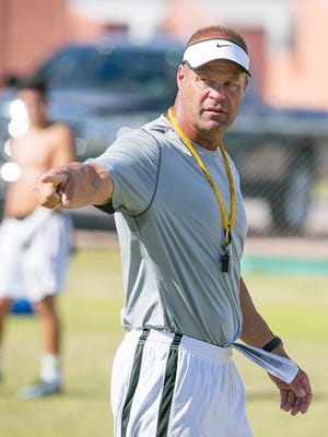 Gilbert Highland head coach Pete Wahlheim addressees the team during spring practice in Gilbert on Tuesday, April 28, 2015.