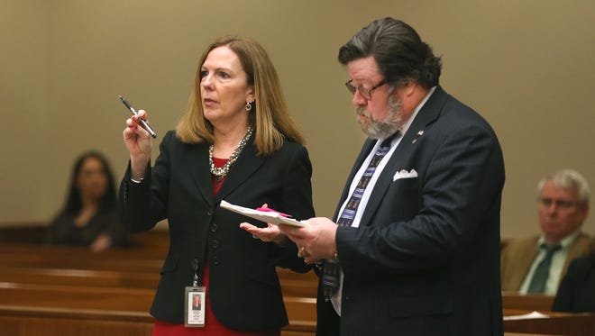 A file photo of Monroe County District Attorney Sandra Doorley and defense attorney James Hinman going over matters with Judge Thomas Moran.