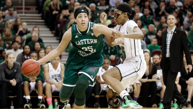 Eastern Michigan forward Brianna Puni (35) drives on Ohio forward Jasmine Weatherspoon in the finals of the NCAA Mid-American Conference women's basketball championship game Saturday, March 14, 2015, in Cleveland.