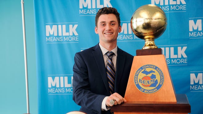 Foster Loyer poses with the Mr. Basketball trophy on Monday in Detroit.