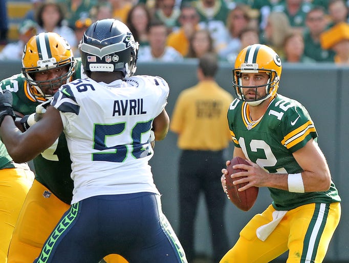 Green Bay Packers quarterback Aaron Rodgers (12) looks