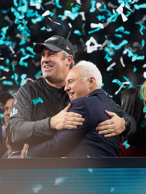 Eagles owner Jeffrey Lurie and head coach Doug Pederson celebrate winning the Super Bowl LII at US Bank Stadium.