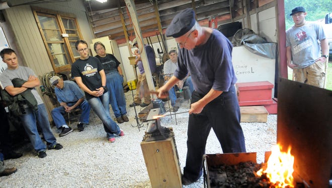 Steve Lowery makes a tool during a blacksmithing demonstration in Enterprise, Ala.