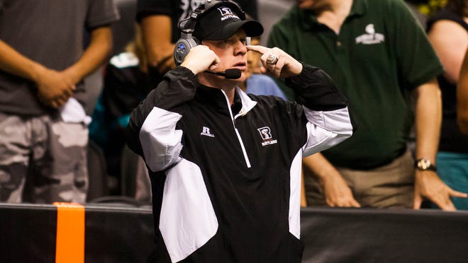 
Coach Kevin Guy watches the Jacksonville Sharks and Arizona Rattlers game on Saturday, April 5, 2014.
